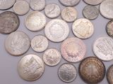 a lot of coins that are on the table