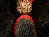 an image of a close up of a red and black hat