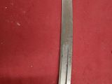 a knife that is sitting on top of a red cloth