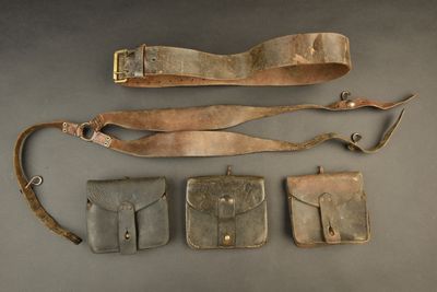an image of a group of leather items sitting on top of a table