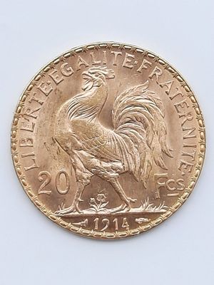 l'image d'une pièce d'or ornée d'un coq