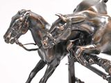 a bronze statue of a horse and a rider on a horse
