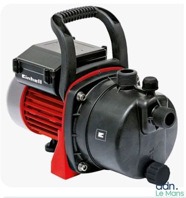 an image of a pump with a red hose attached to it