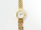 a gold and silver watch with a white face