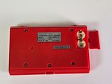 a close up of a red device on a white surface