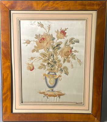 tableau représentant des fleurs dans un vase posé sur une table, dans un cadre en bois