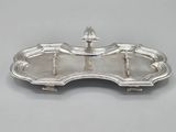 a silver tray with a handle on top of it