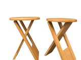 pair of wooden folding stools on a white background