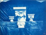 a picture of a picture of a building with a blue tarp covering it