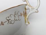 a close up of a cup with a handle on it