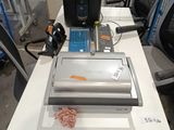 a machine that is sitting on a table in a warehouse