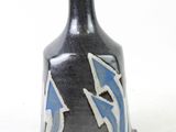 a black vase with blue and white designs on it