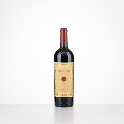 a bottle of red wine sitting on top of a table