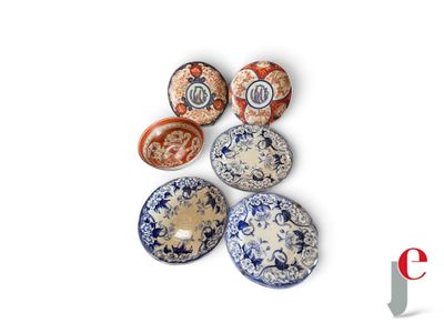 several different types of ceramic bowls are arranged on a white surface