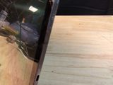 a picture of a broken cell phone on a table
