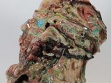 a close up of a sculpture of a man ' s head