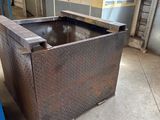 a metal box that is sitting in the middle of the floor