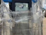 a large pile of plastic wrapped up on a pallet