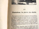 un livre ouvert sur lequel figure l'image d'une femme et d'un chien