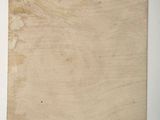 a close up of a piece of wood with a piece of paper on it