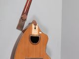 a guitar hanging on the wall next to a guitar