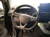 a steering wheel and dashboard of a car in a car showroom