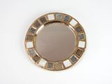 a mirror that is sitting on a table