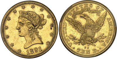 a gold coin with an eagle on the front and a woman ' s head on the back