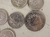 a lot of coins that are sitting on a table