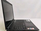 a black laptop computer sitting on a white surface