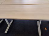 two tables that are sitting in a room