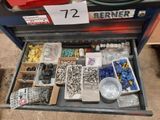 a drawer full of assorted screws and nuts