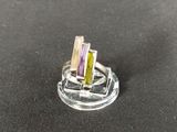 a ring that has three different colored stones in it
