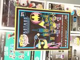 a poster on the wall of a store with many stickers on it
