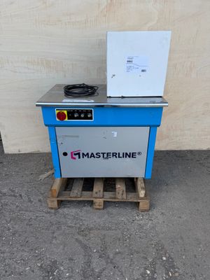the machine is sitting on a pallet next to a wall