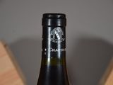 a bottle of wine that is sitting on a table