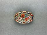 an image of a broochle with flowers on it