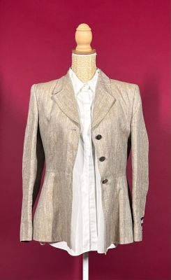 an image of a woman ' s jacket on a mannequin stand