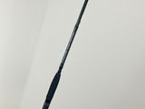 a close up of a fishing rod on a white surface