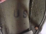 a close up of a pair of shoes with a us stamp on them