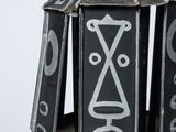 a black and white photo of a decorative object