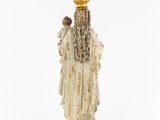 an old statue of a woman with a crown on her head