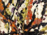 une peinture abstraite aux couleurs noir, orange, jaune et blanc