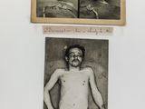 a black and white photo of a man with no shirt on