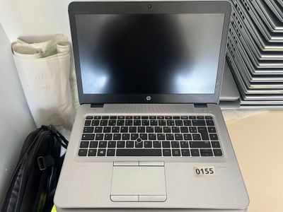 a laptop computer sitting on top of a desk