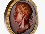 an image of a picture of a woman ' s head in a gold frame