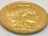 an image of a close up of a gold coin on a white surface