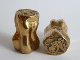 pair of vintage brass salt and pepper shakers in the shape of a man and woman ' s torso
