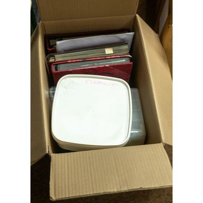 a box full of cds and cds sitting on the floor