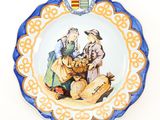a plate with a picture of a man and a woman on it